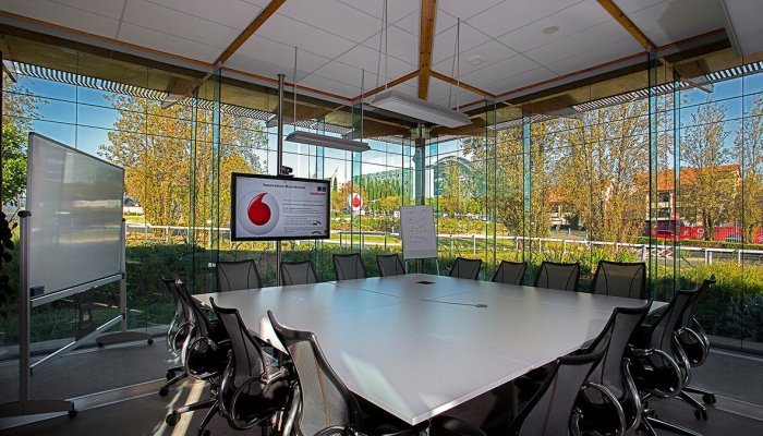 Vodacom’s Midrand Innovation Centre has the appearance of a transparent glass box with overhangs, natural ventilation, low-energy design with solar installation, and an inner ‘wetland’ courtyard, designed to achieve a biodiverse site of which 70% was covered in indigenous and endemic vegetation. 